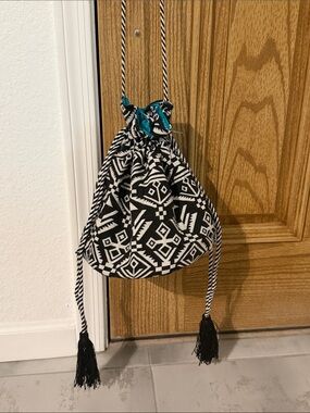 Black & White Geometric Drawstring Bucket Bag with Teal Accent